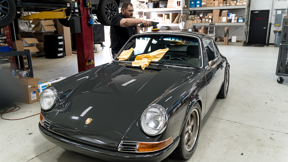 vintage grey Porsche getting polished and detailed