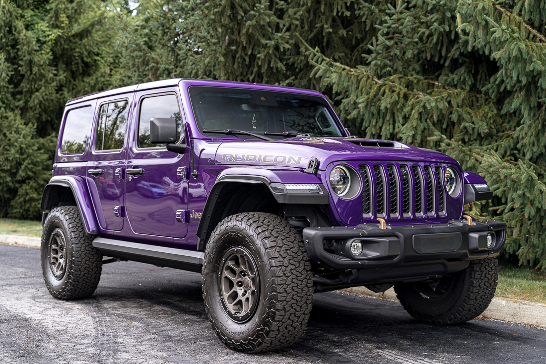 Purple Jeep 392 with black Oracle tail lights, amp running boards, LED side marker lights, Borla exhaust